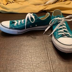 Turquoise Converse All Star low top sneakers.